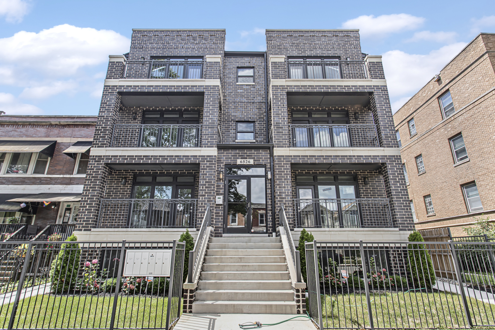 a view of a brick building with many windows