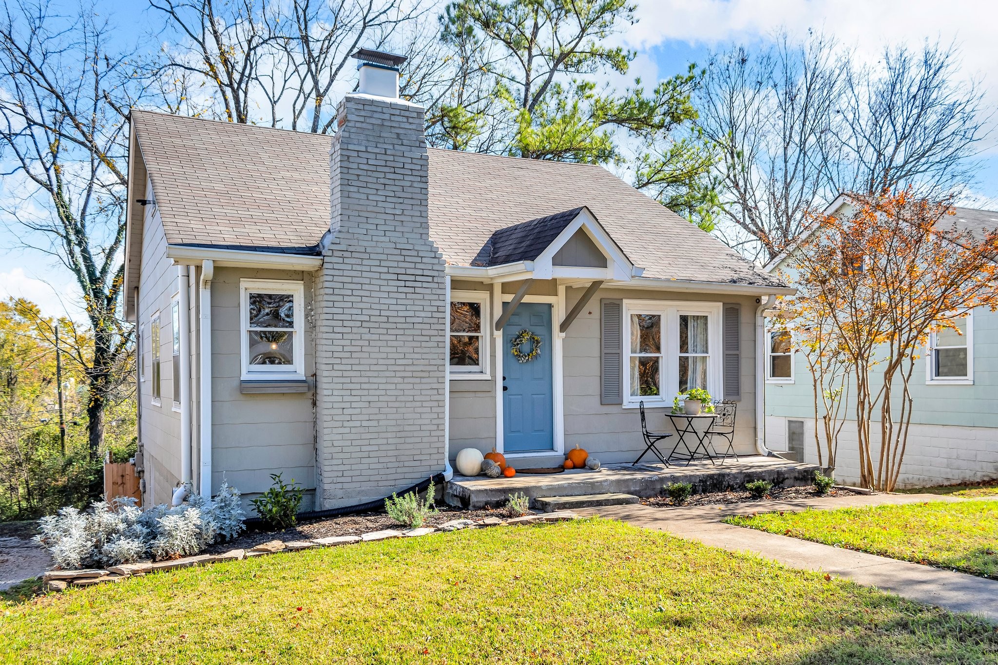 a front view of house with yard outdoor seating and garage