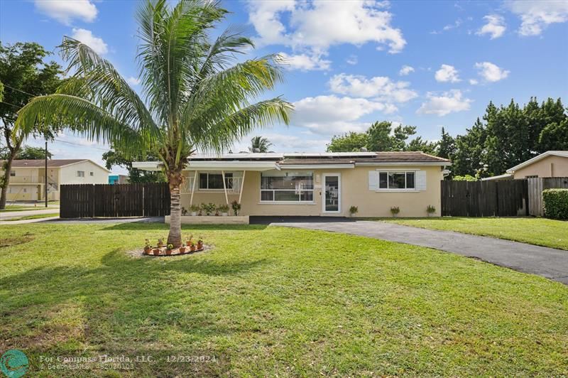 a front view of house with yard and seating area