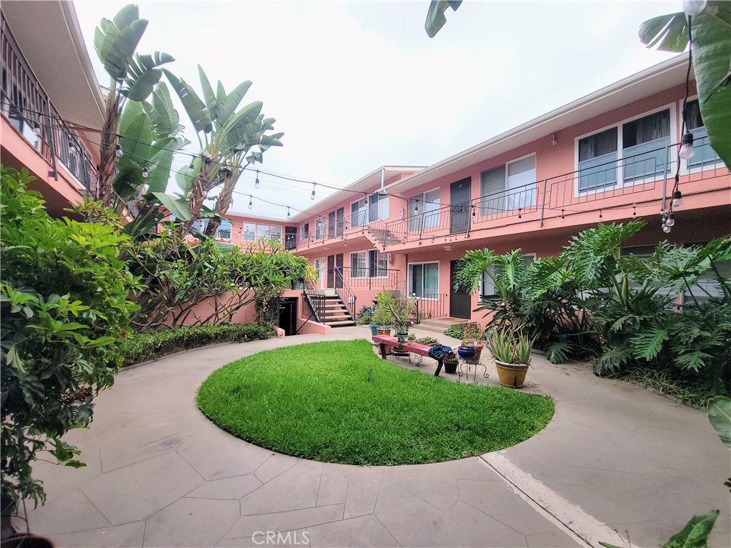 a view of a house with a garden and plants