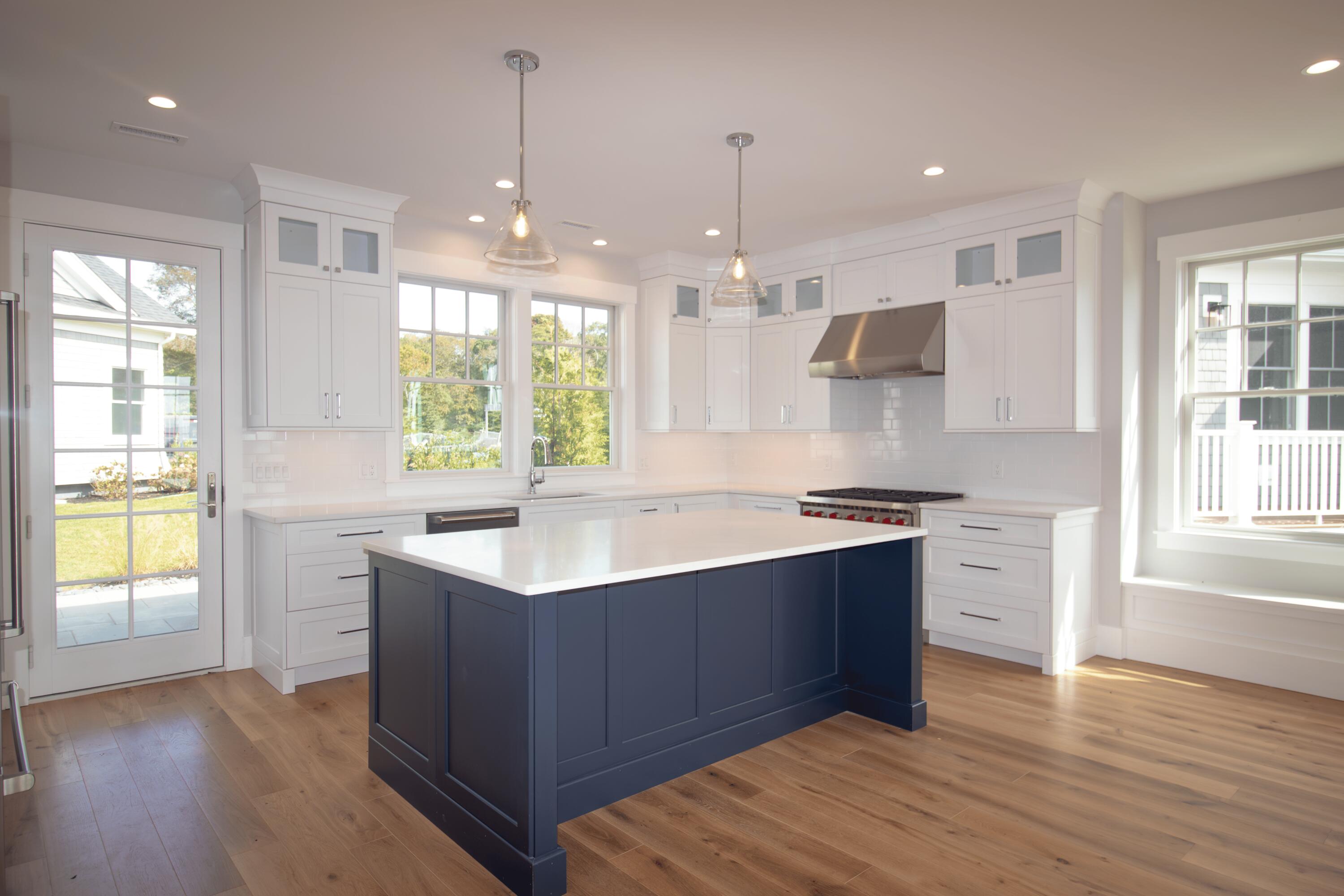 a kitchen with a sink stove and wooden cabinets