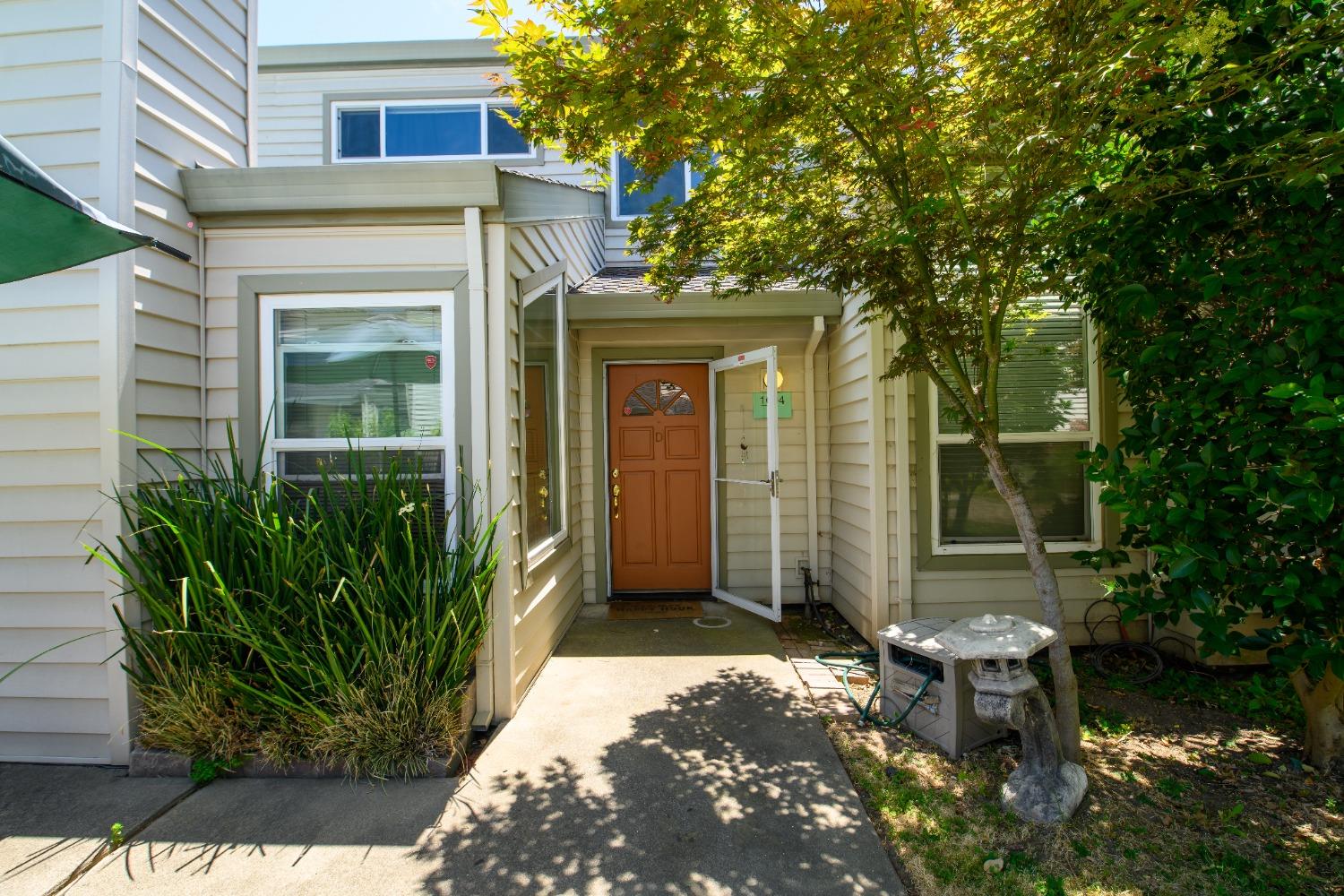 a front view of a house with a yard