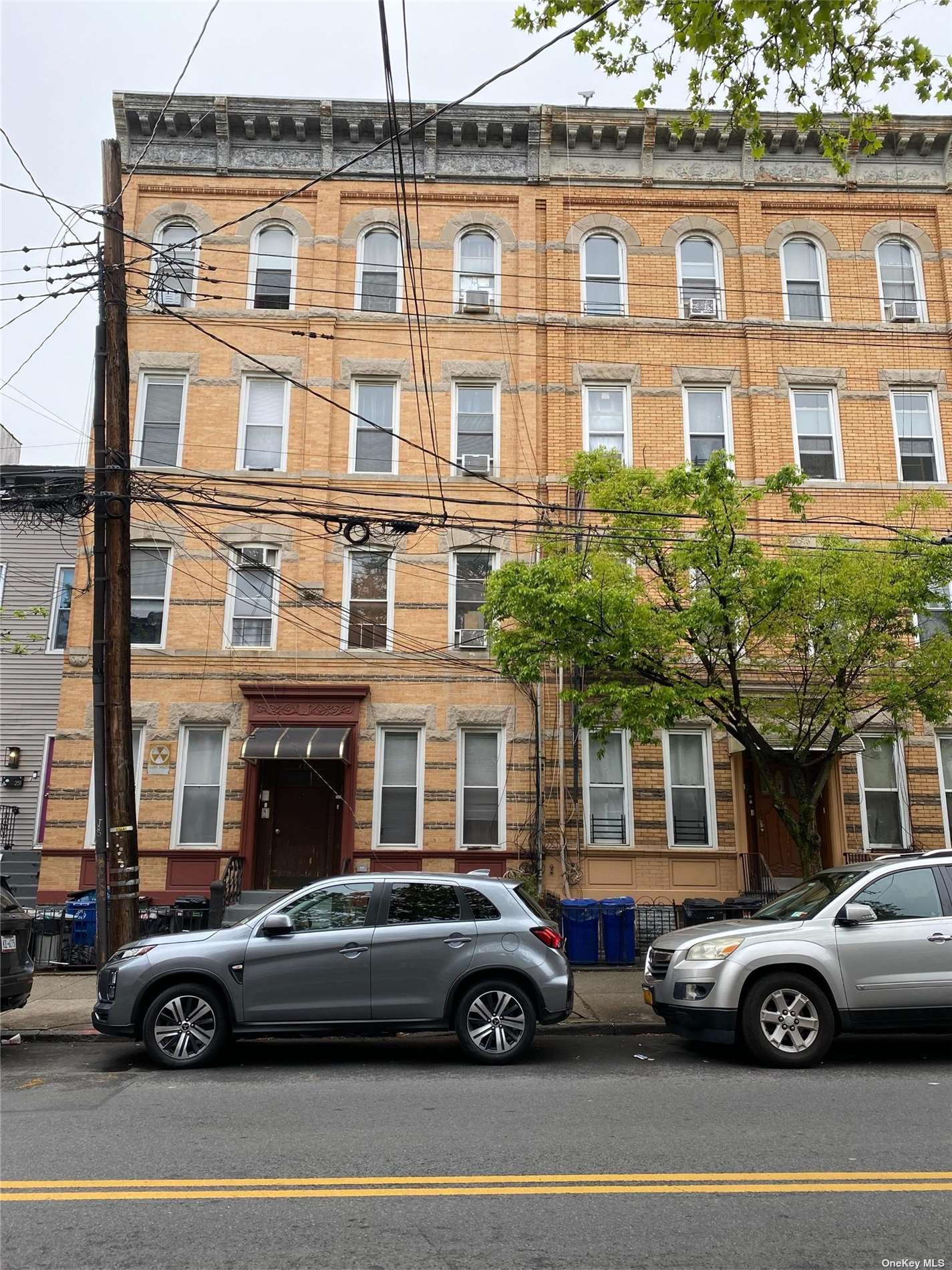 a front view of a house with parking space