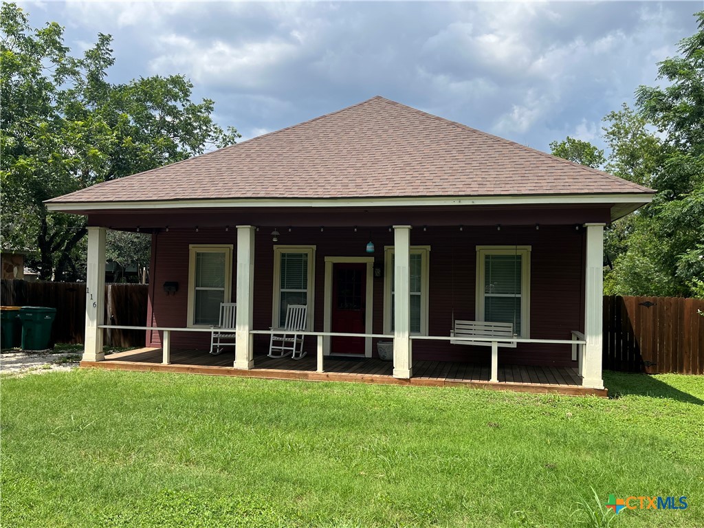 front view of a house with a yard