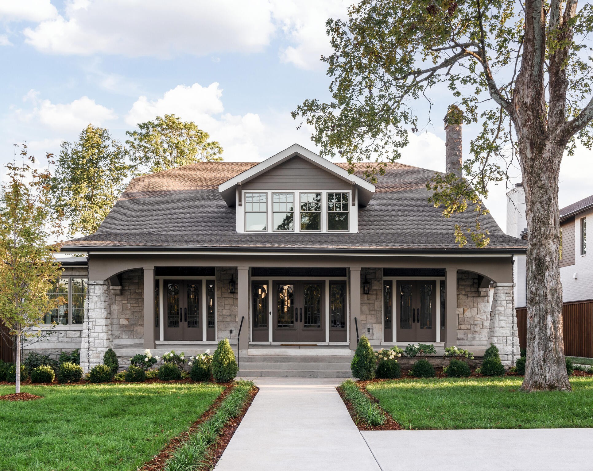 front view of a house with a yard