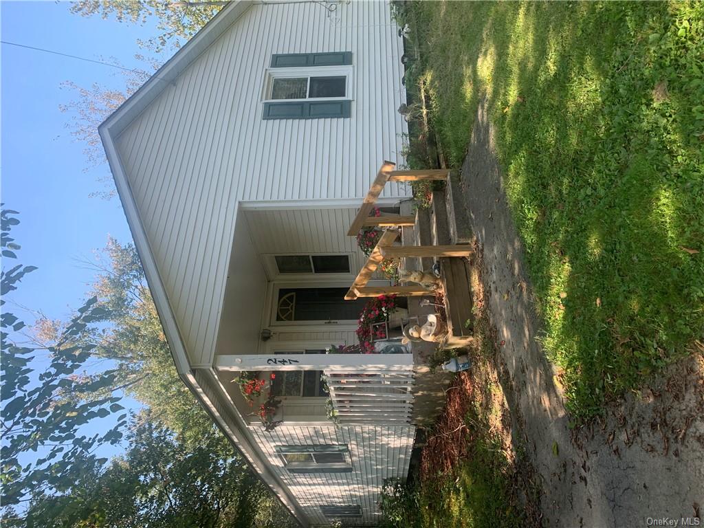 a front view of a house with patio outdoor seating