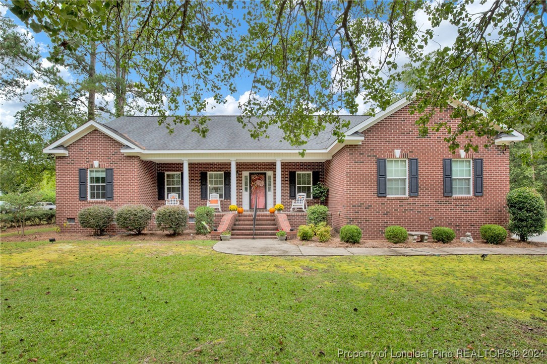 front view of a house with a yard