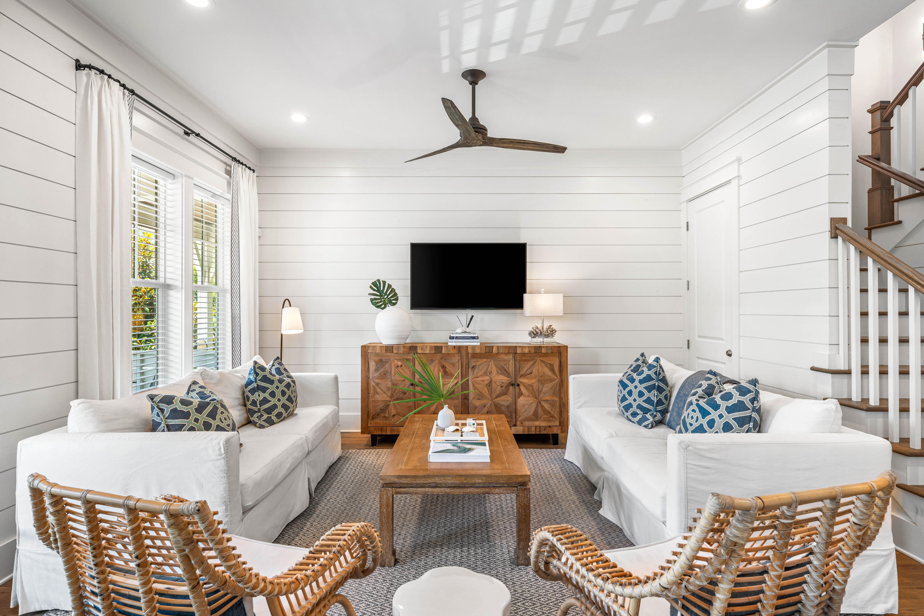 a living room with furniture and a flat screen tv