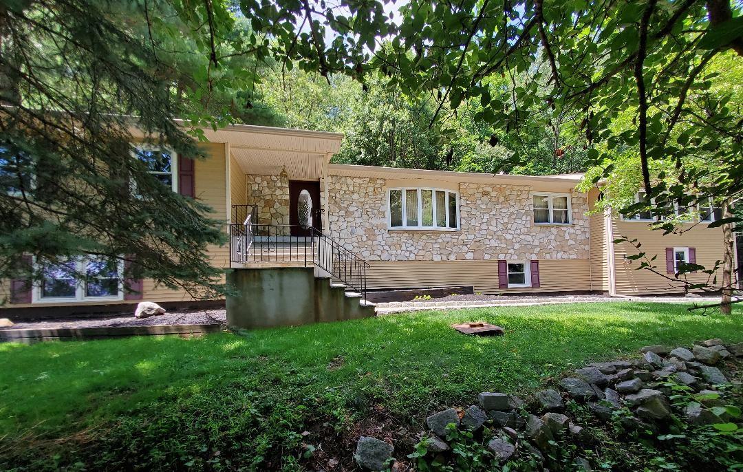 Stone and vinyl ranch style home