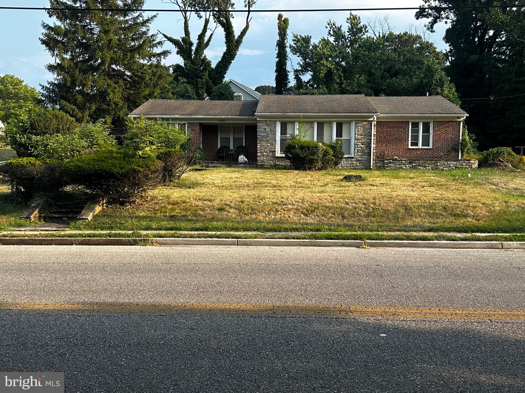 a front view of a house with swimming pool