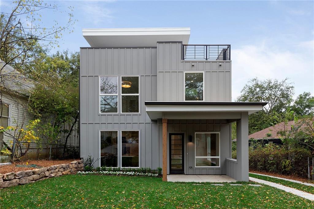 front view of a house with a yard