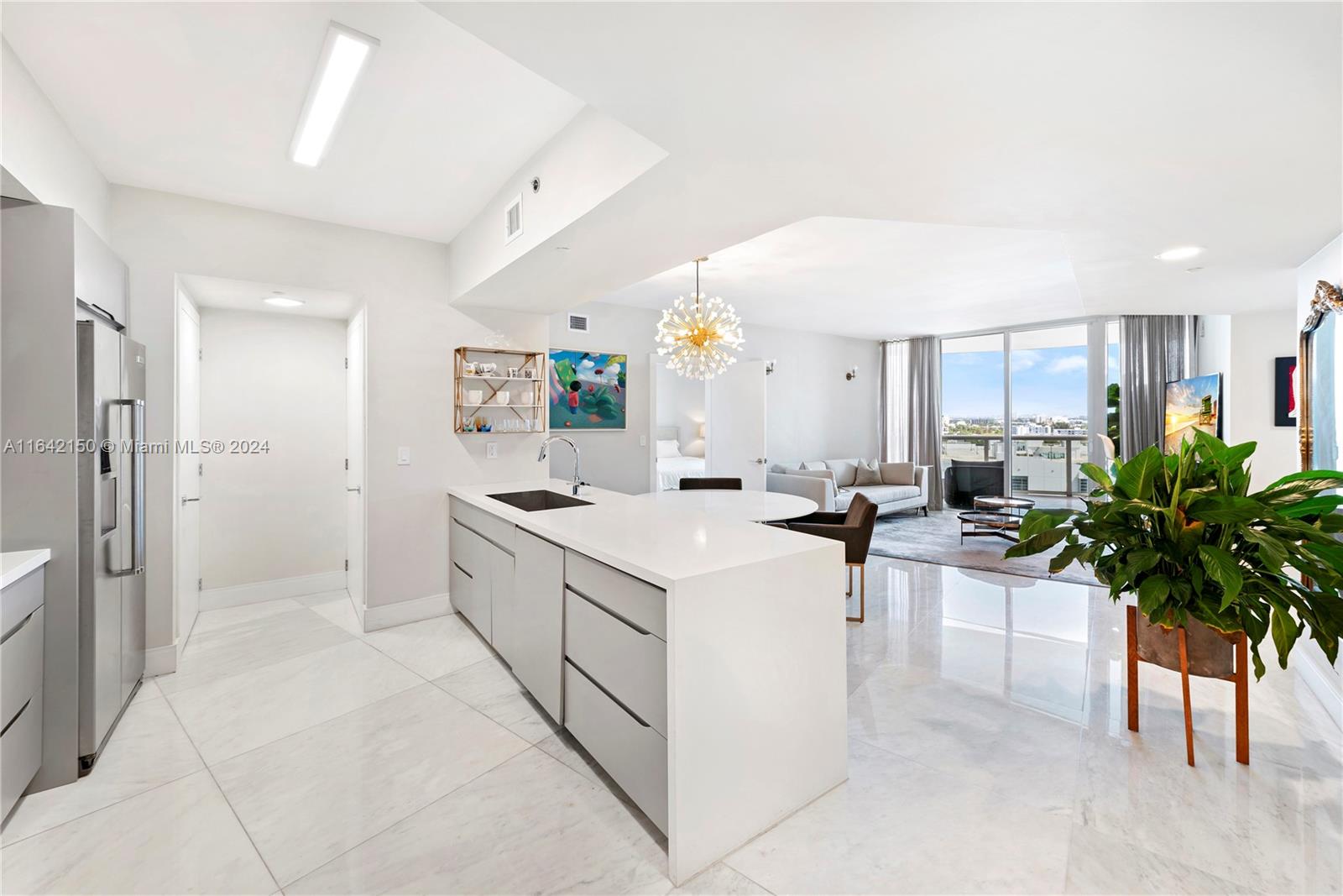 a kitchen with furniture a counter and a refrigerator