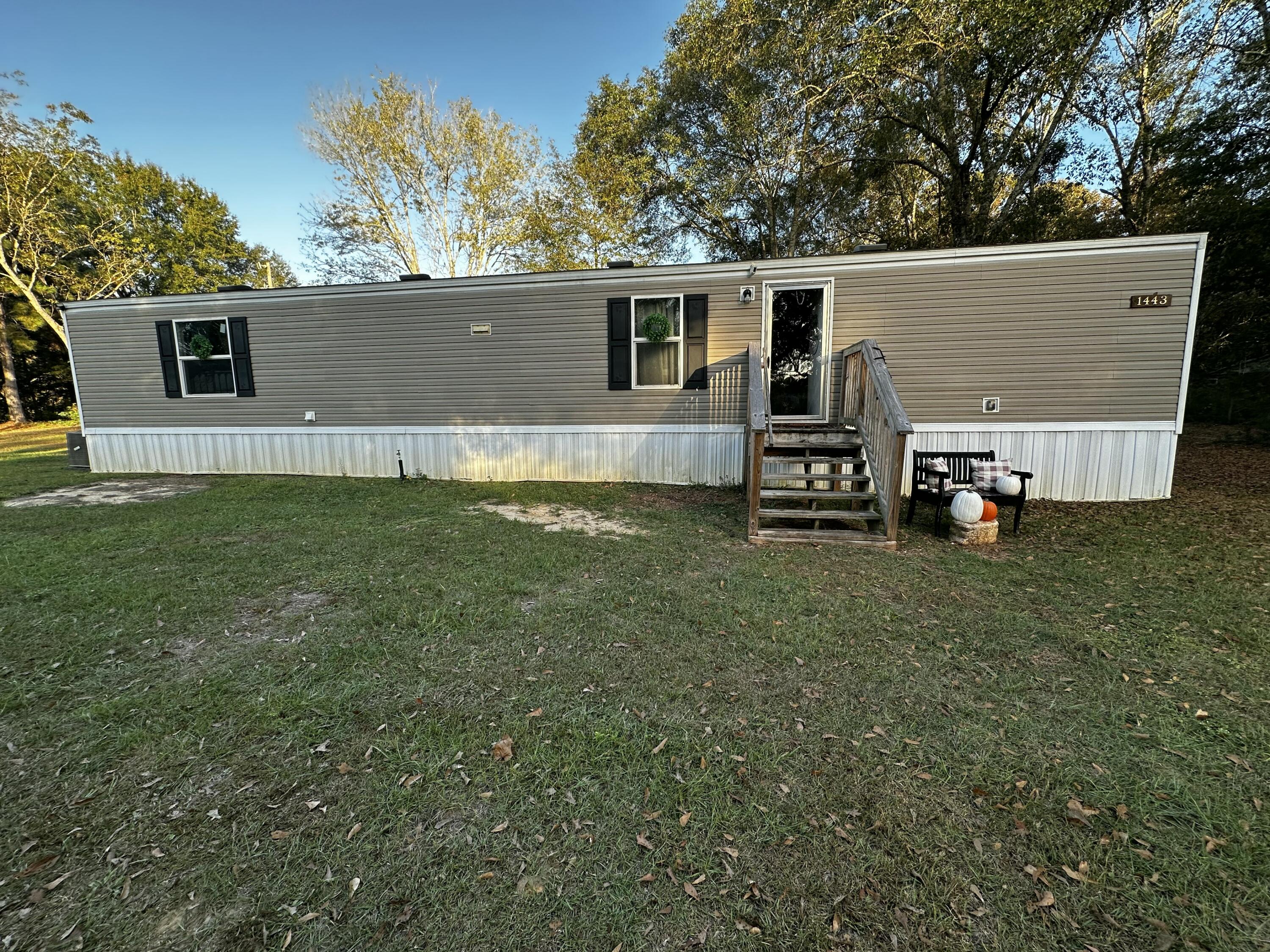 a view of a house with a back yard