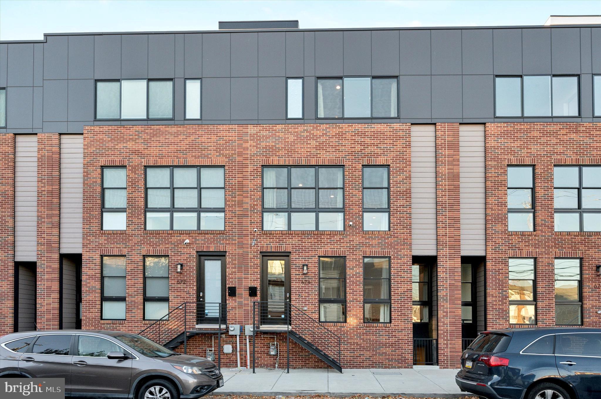 a front view of a building with parking space