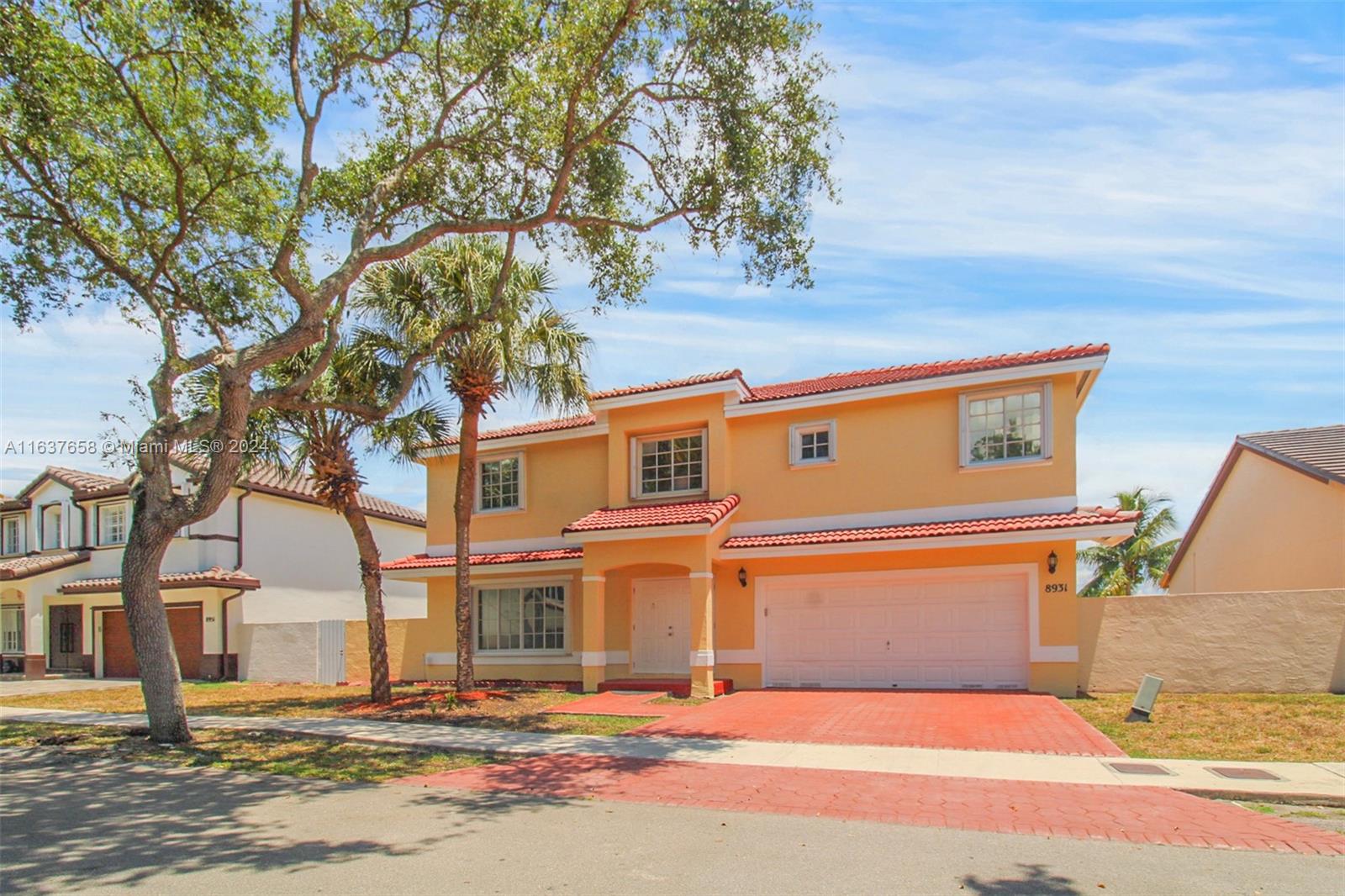 front view of a house with a trees