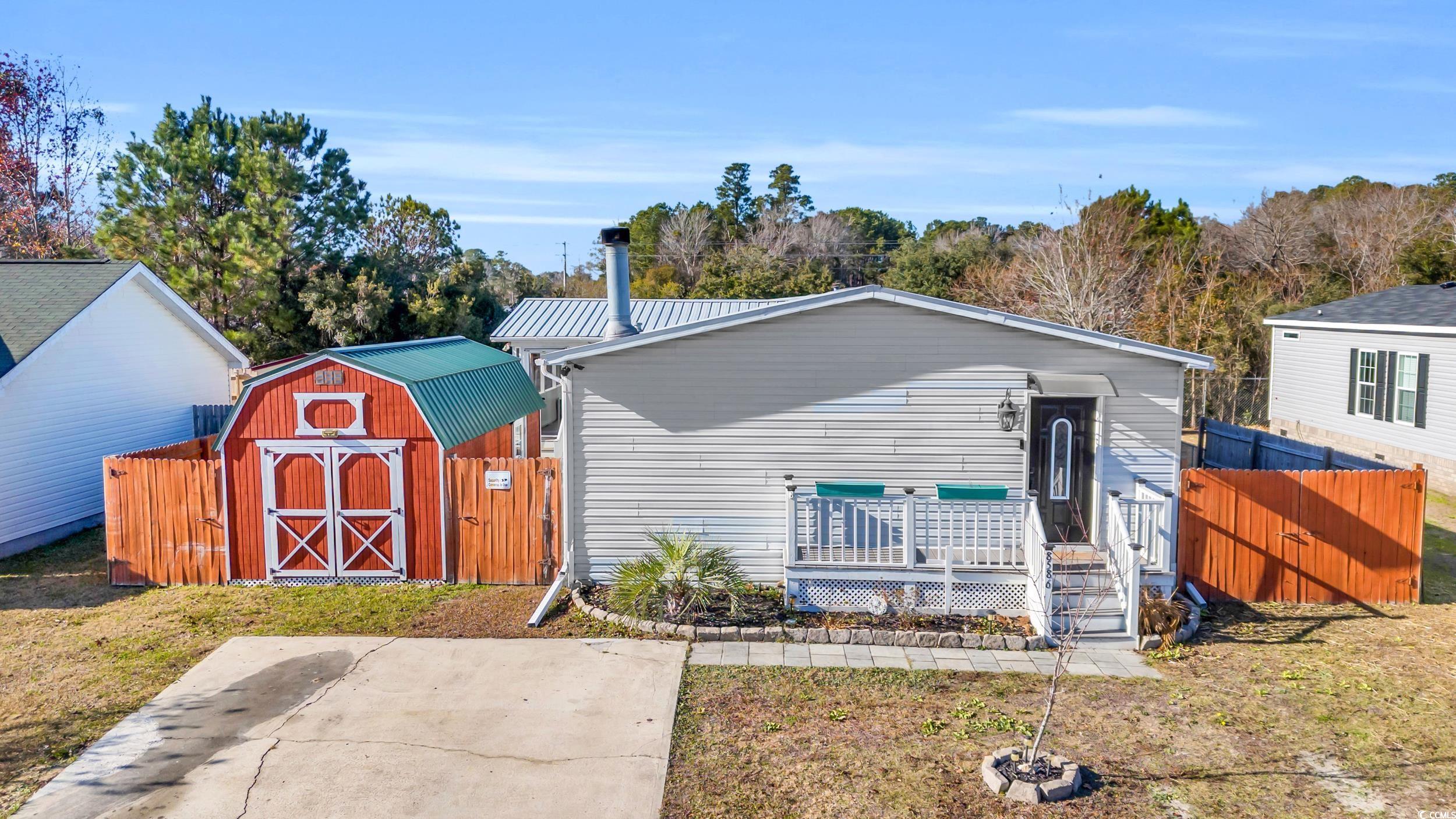 View of front facade featuring a storage shed