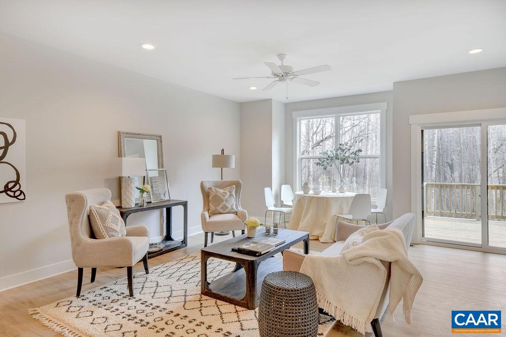 a living room with furniture or couch and two windows