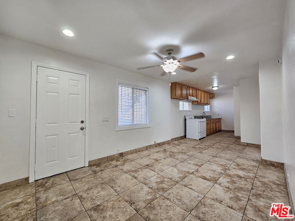 a view of a livingroom with a kitchen