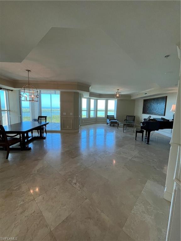 a room with furniture and a large window