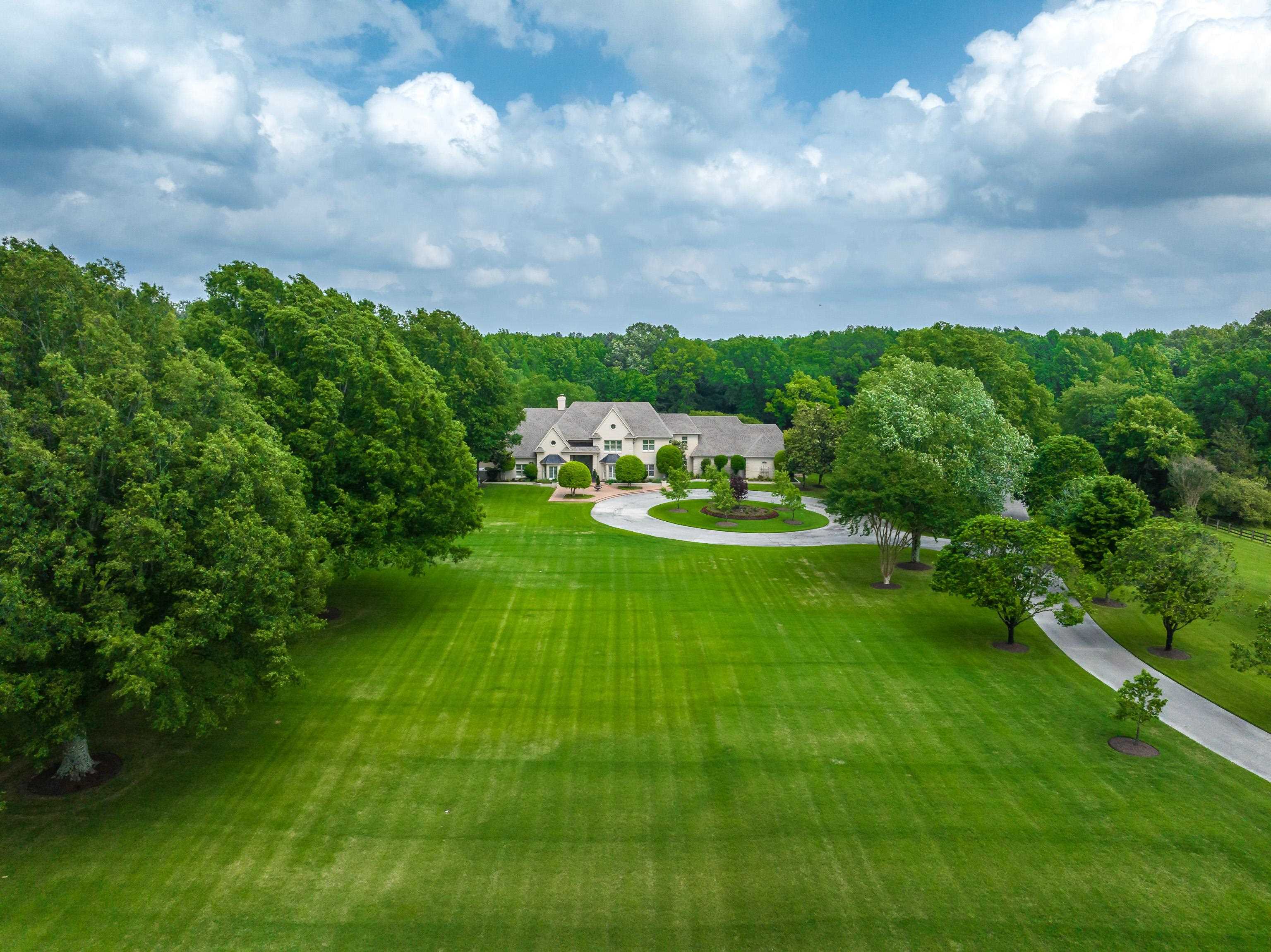 a view of a house with a big yard