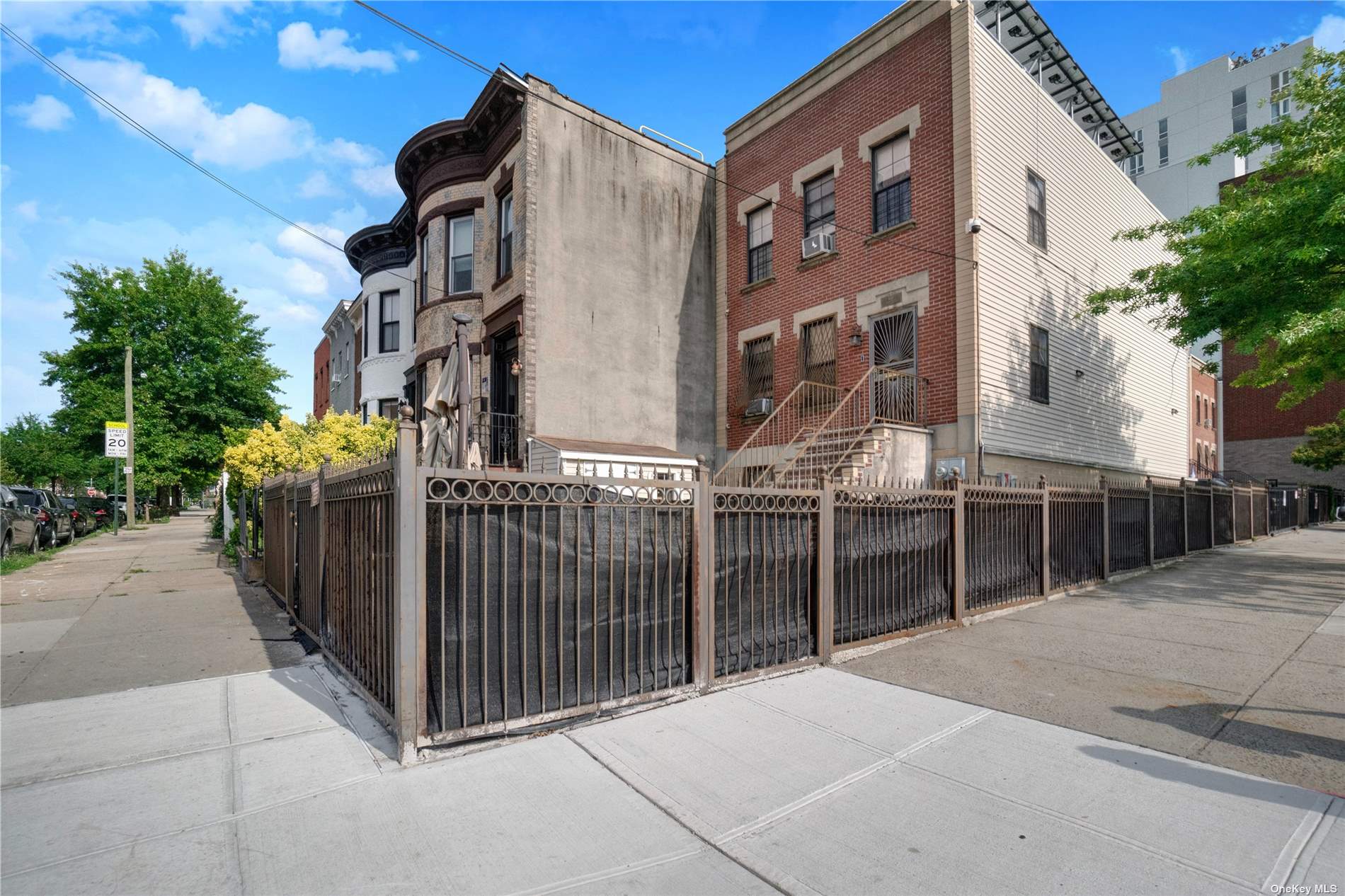 a view of a building with iron fence