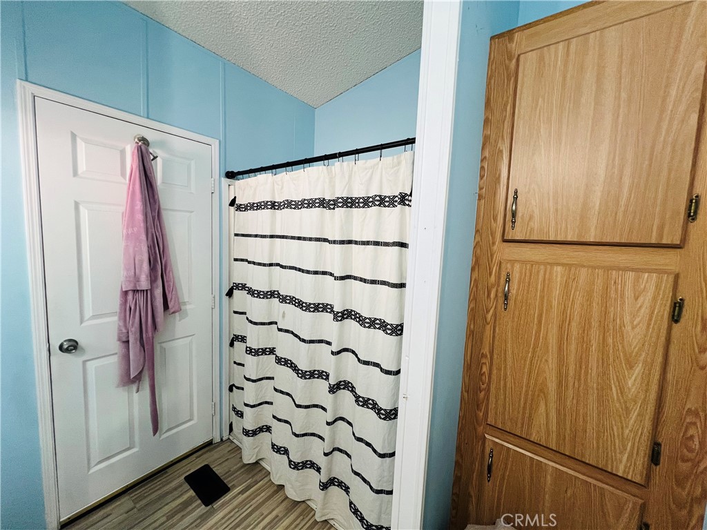 a view of a bathroom with a shower and a sink