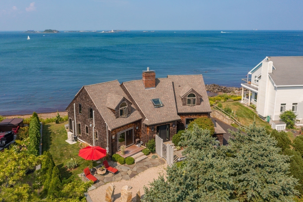 an aerial view of a house with outdoor space