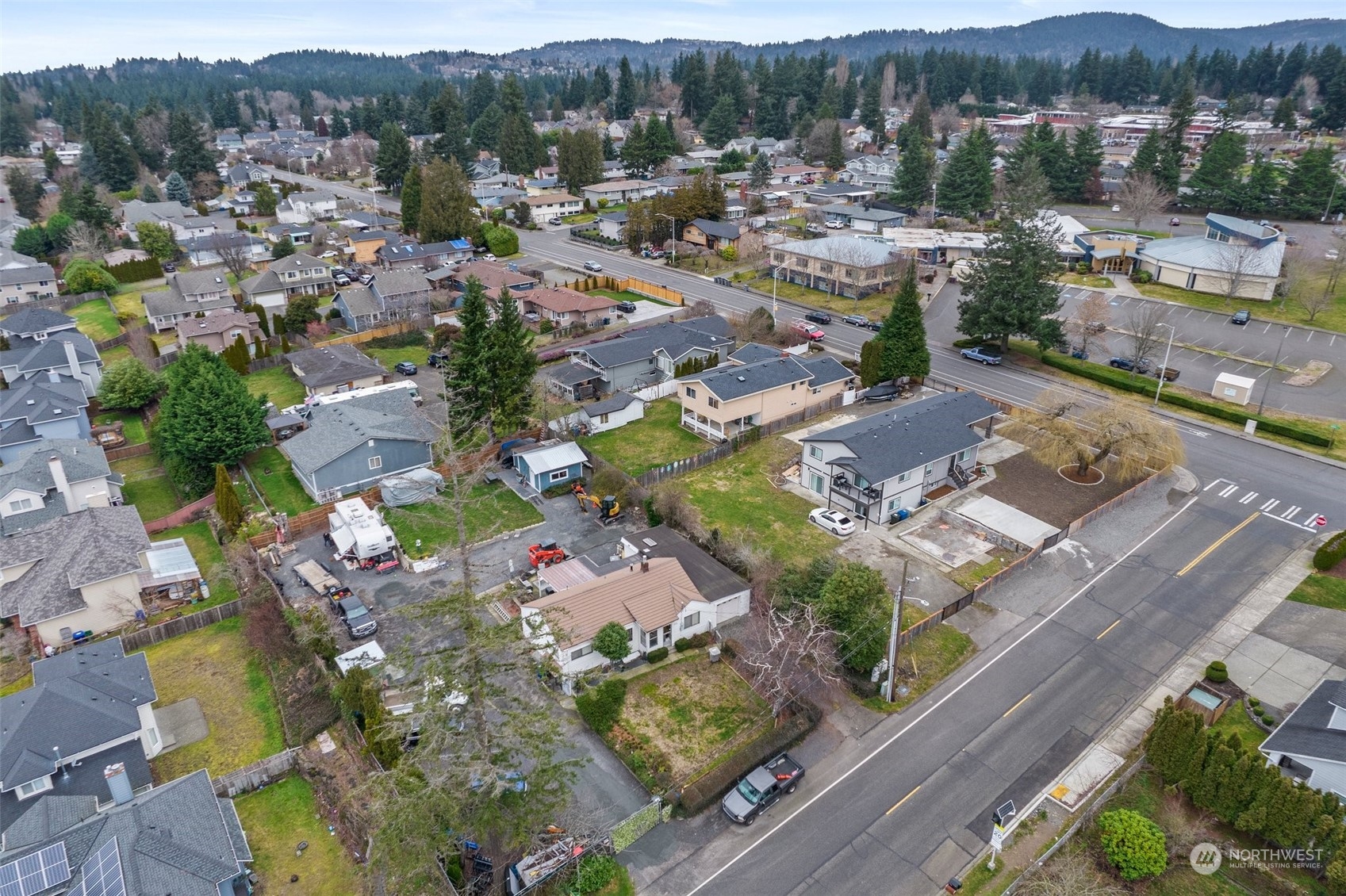 an aerial view of residential houses with outdoor space