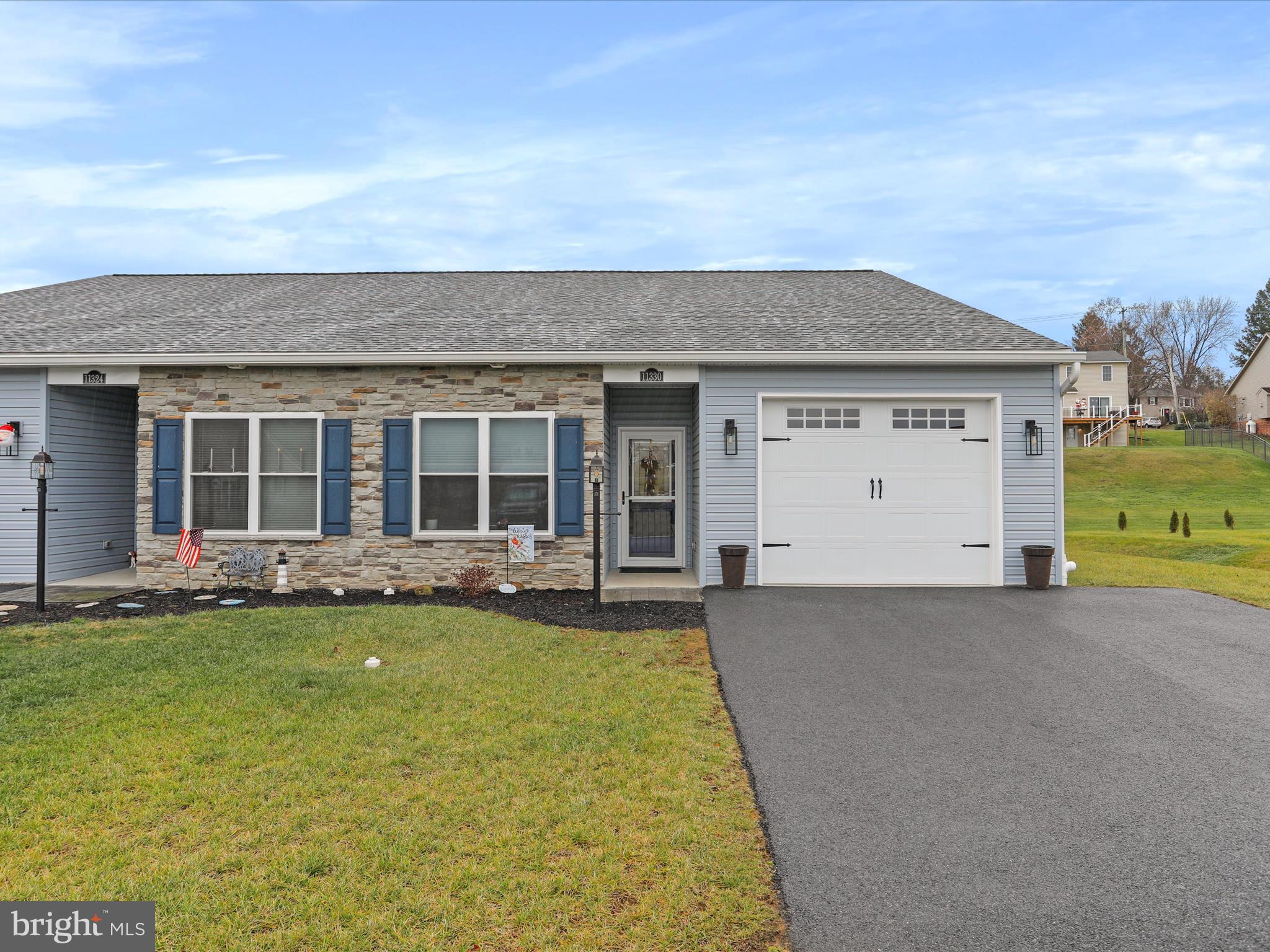 front view of a house with a yard