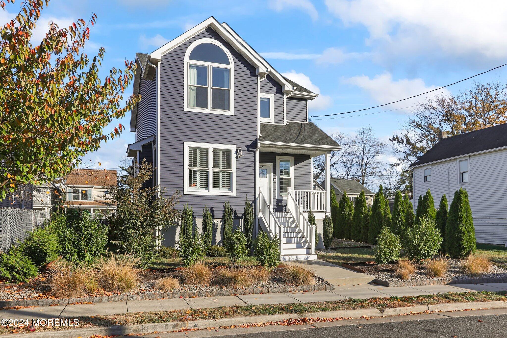 a front view of a house with garden