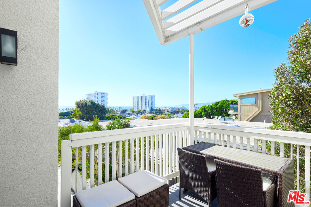 a view of a balcony with a chair