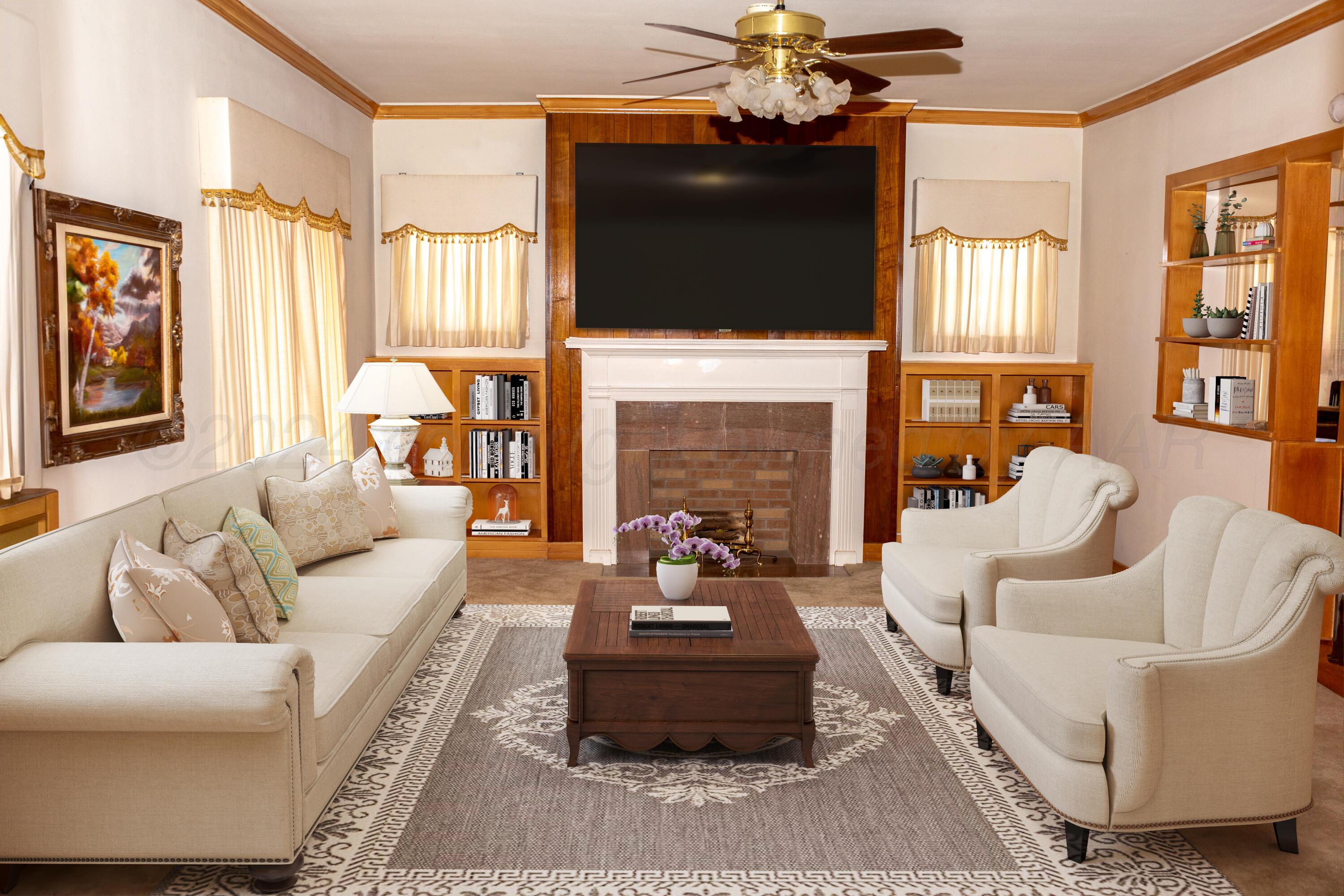 a living room with furniture a fireplace and a flat screen tv