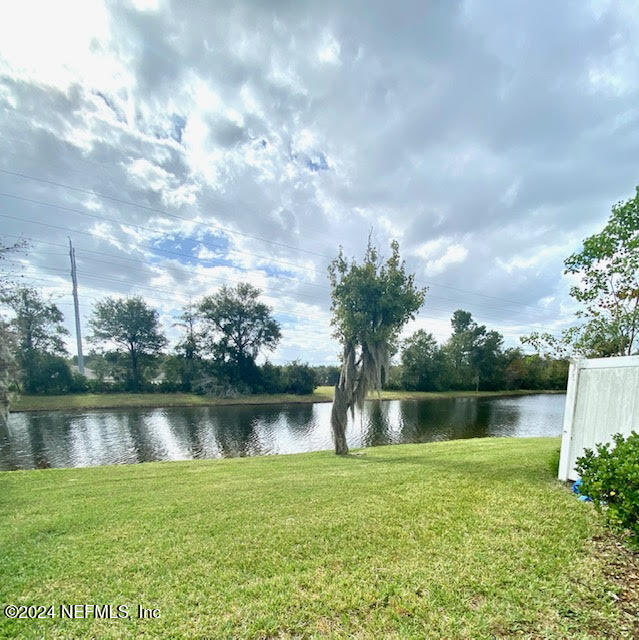 a front view of a house with a lake view