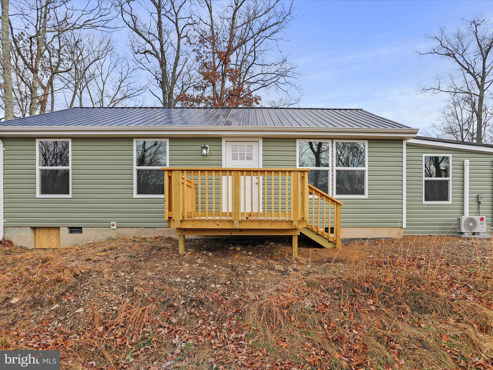 a house with trees in the background