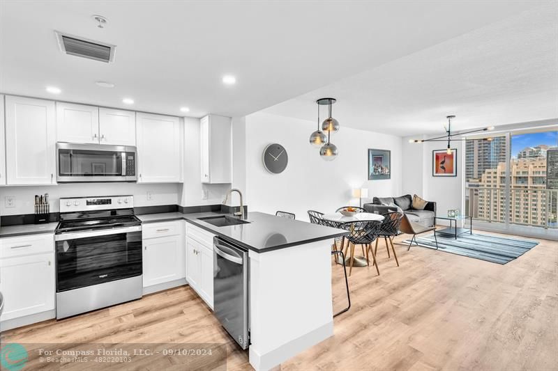 a kitchen with lots of counter top space and appliances