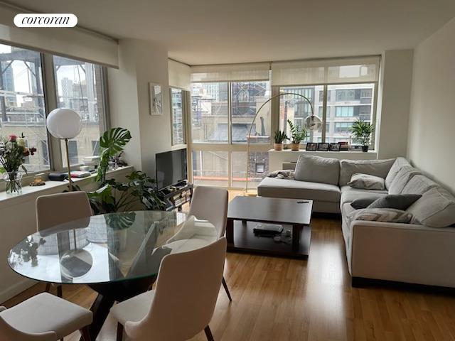 a living room with furniture and a large window