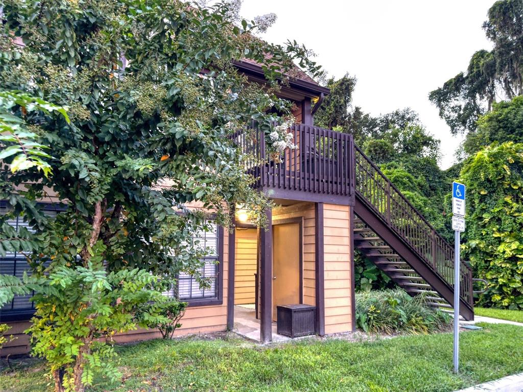 a view of front of house with an outdoor seating