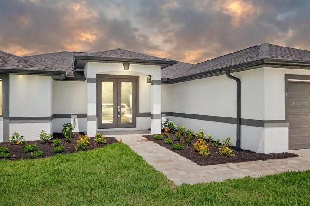 a front view of a house with a yard