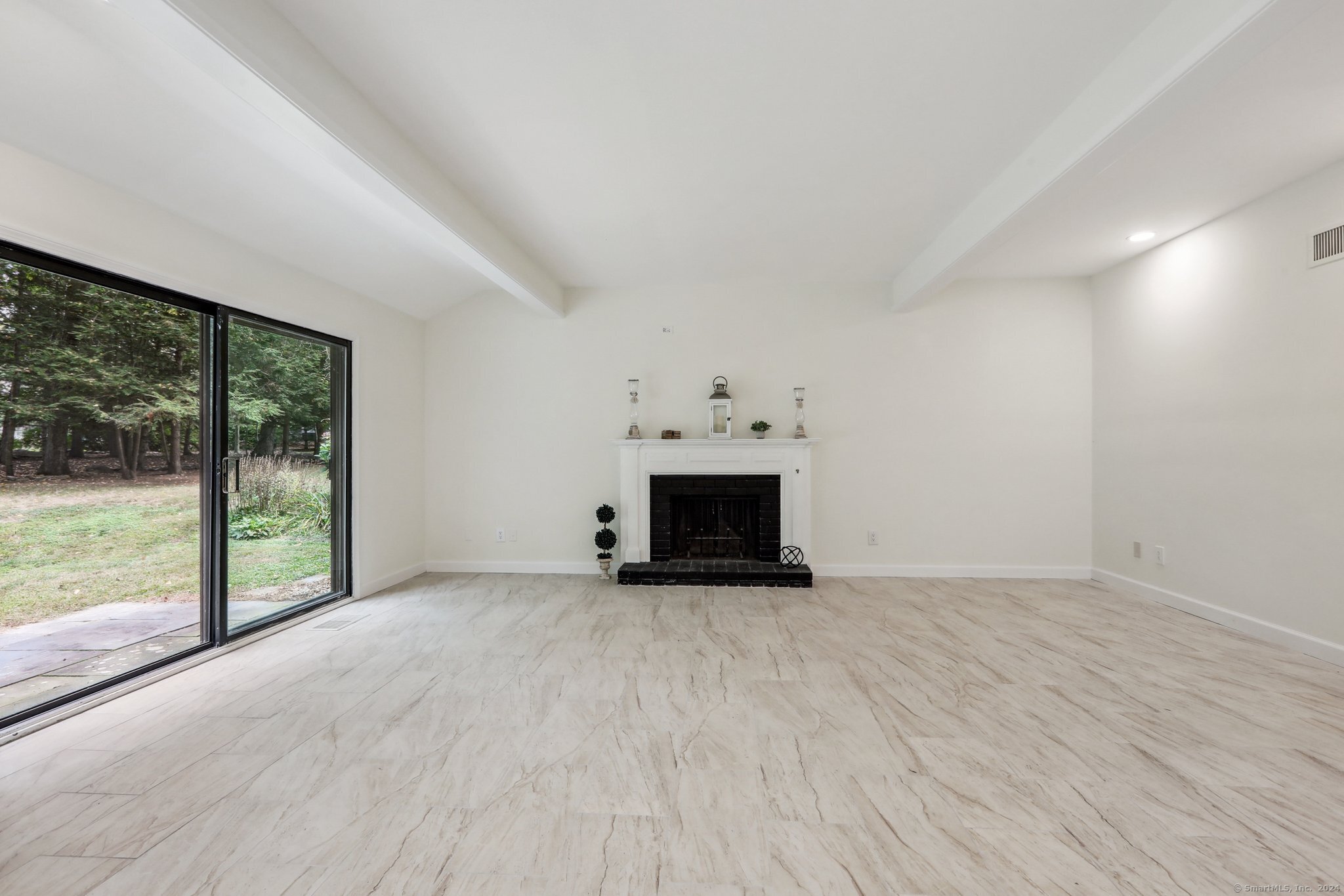 an empty room with fireplace