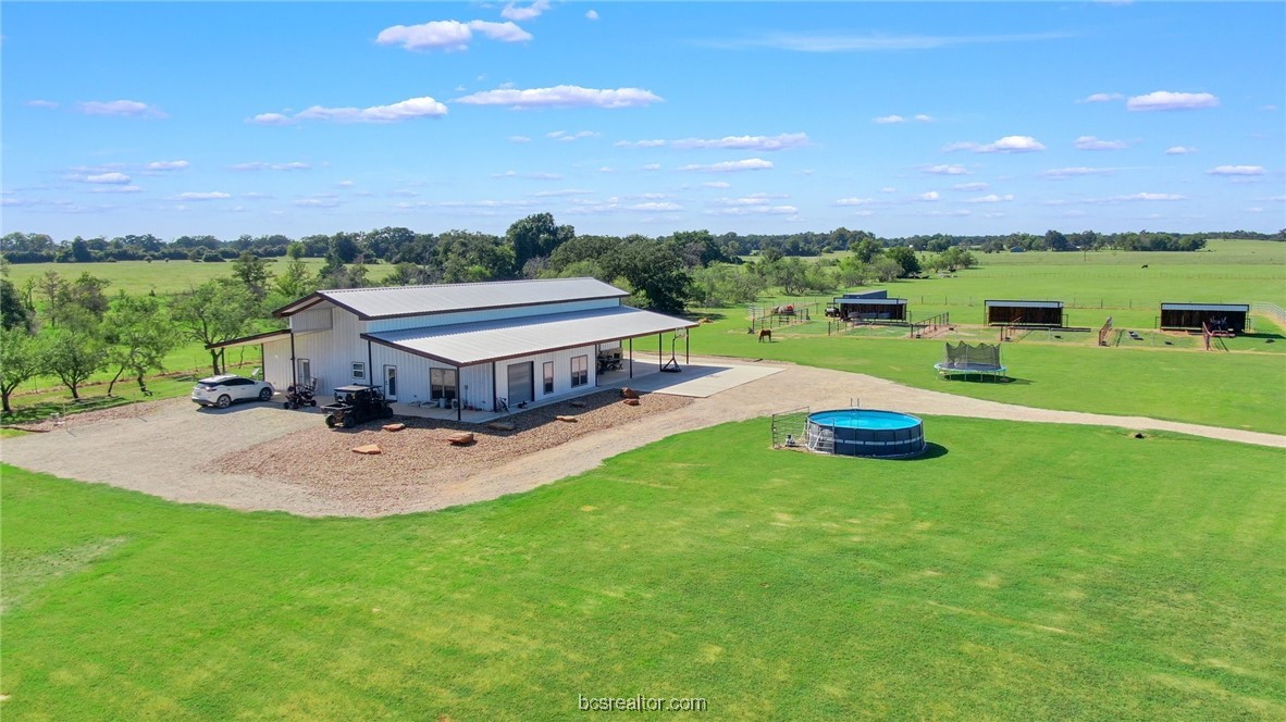 a view of a house with a big yard