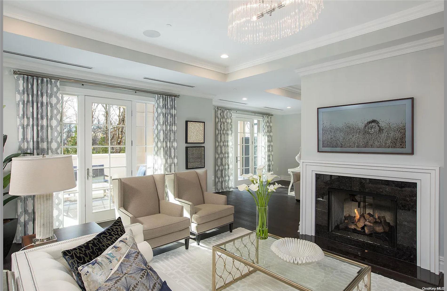 a living room with furniture a window and a fireplace