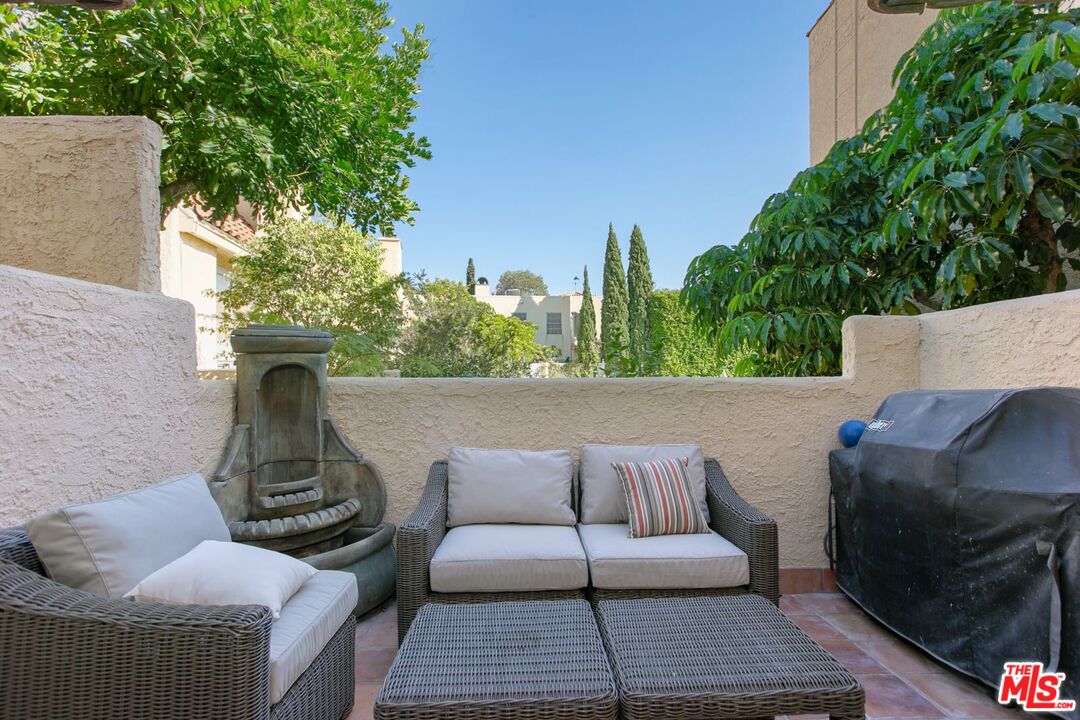 a view of a patio in the backyard