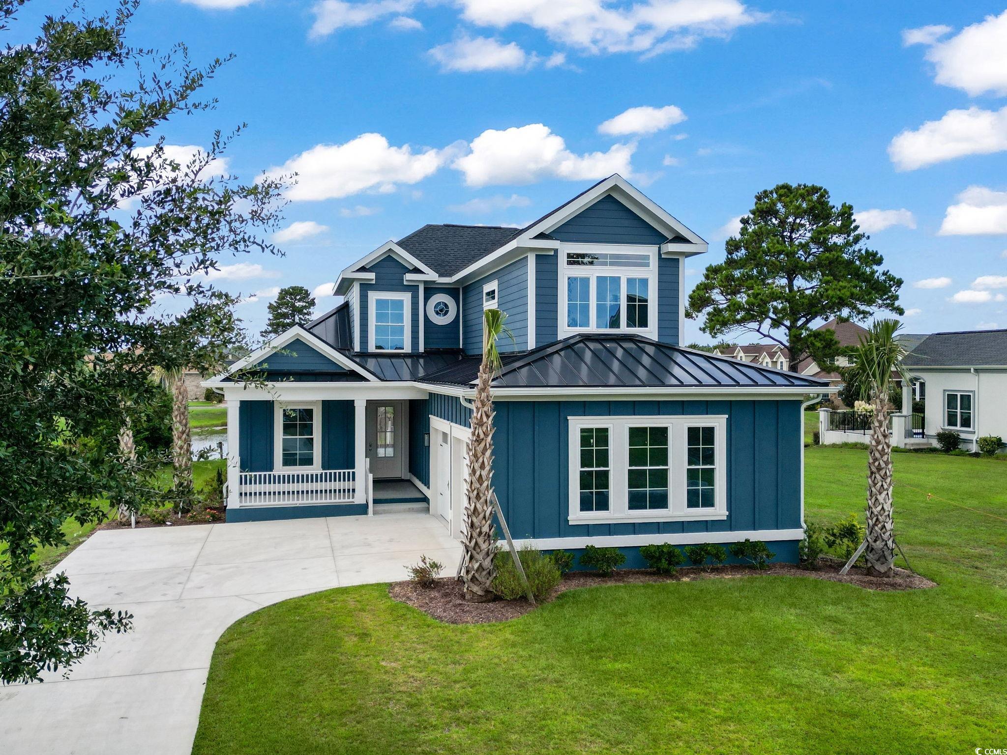 Craftsman-style house featuring a front lawn