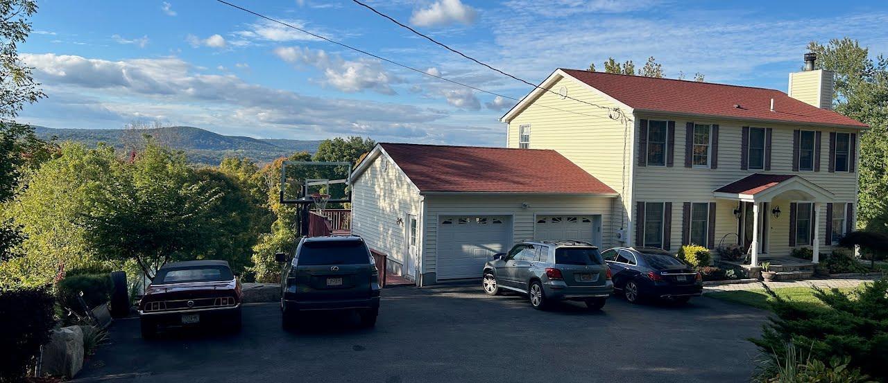 Whole of front of house with mountain view