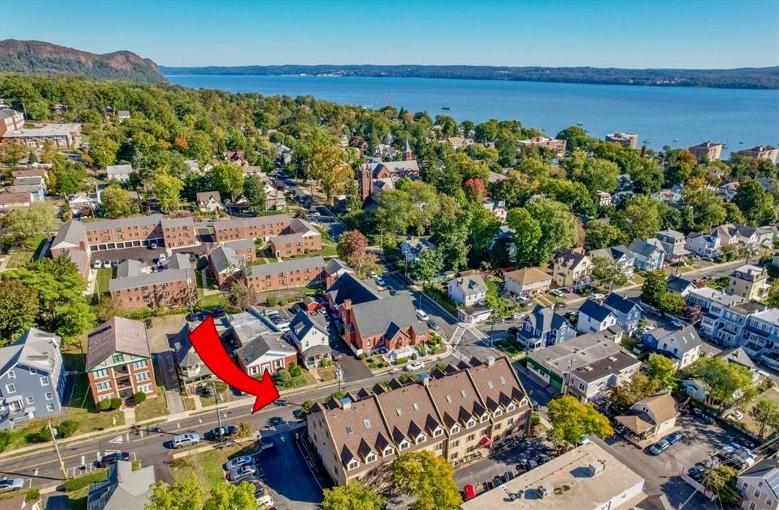 an aerial view of residential houses with outdoor space