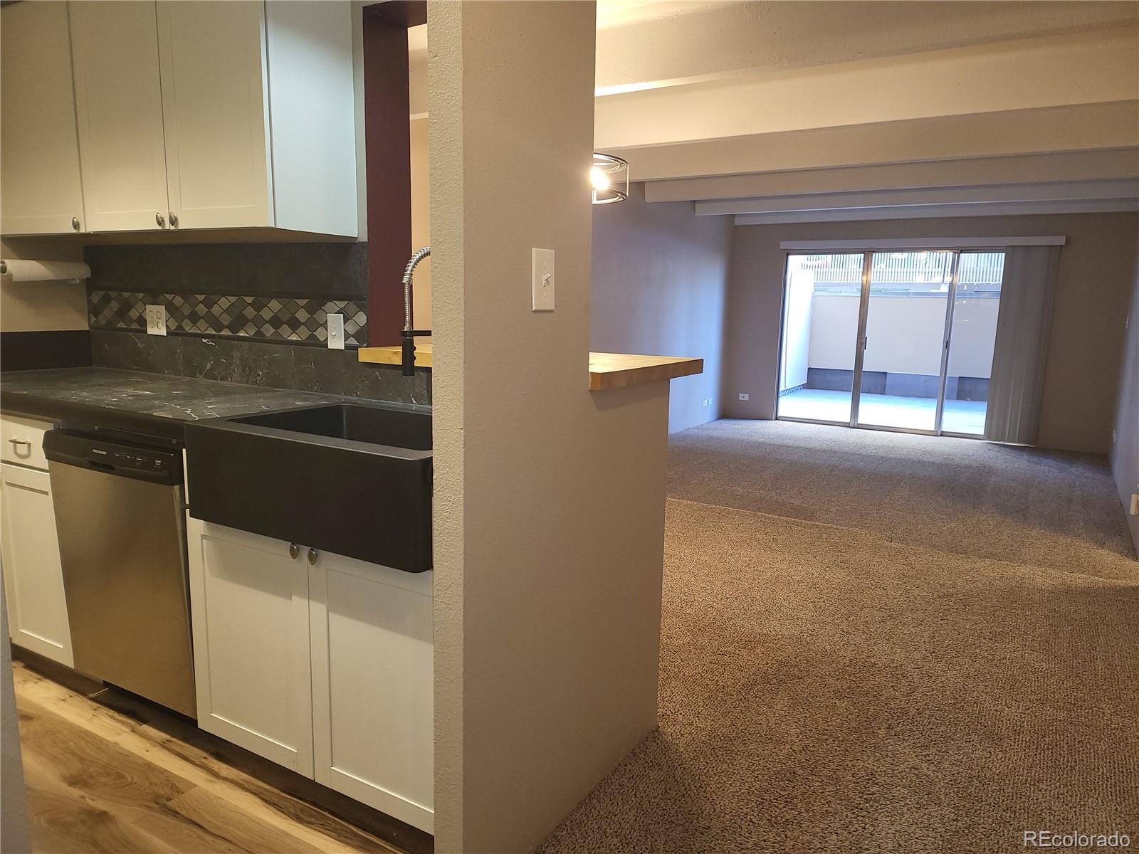 a kitchen with stainless steel appliances granite countertop a stove and a microwave