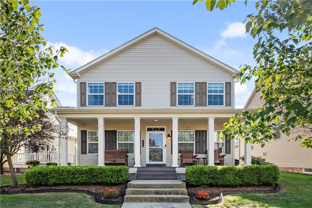 a front view of a house with a yard