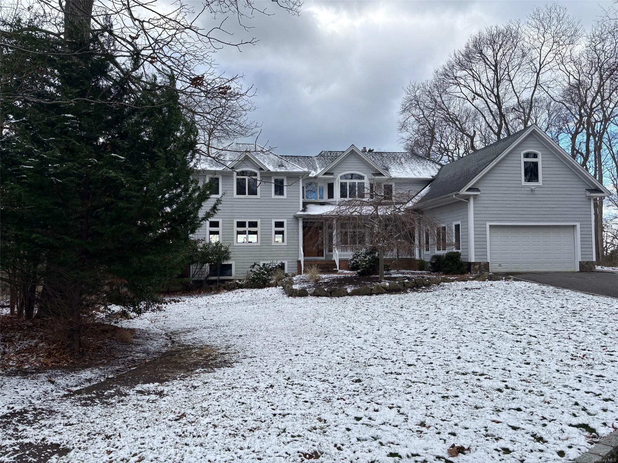 View of property with a garage