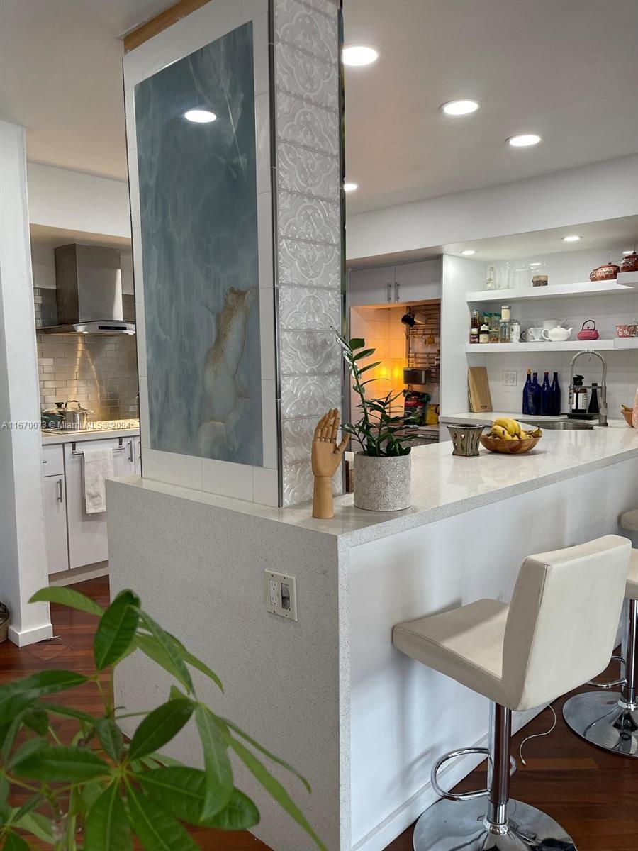 a kitchen with a table and chairs