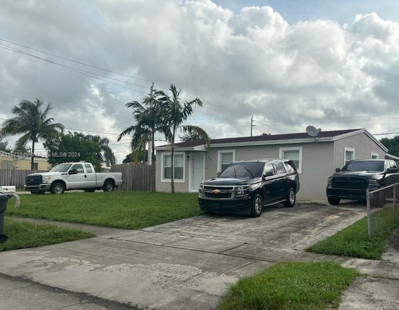 a car parked in front of a house